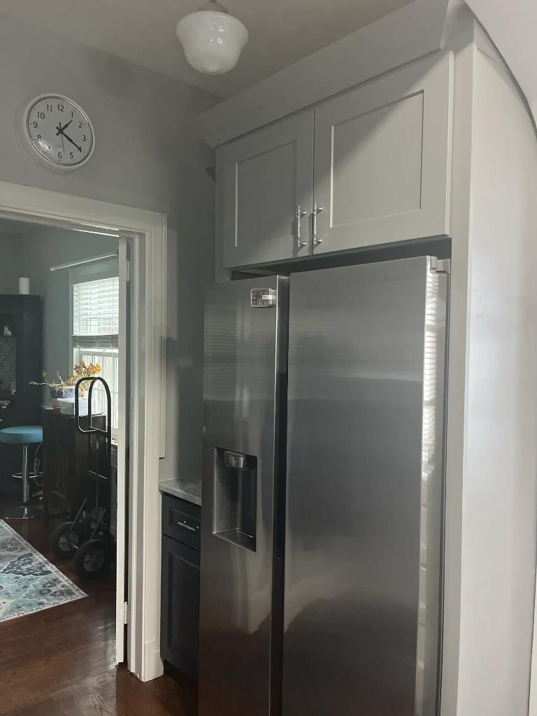 Kitchen remodel with white cabinets and refrigerator by Cornerstone KB Pro