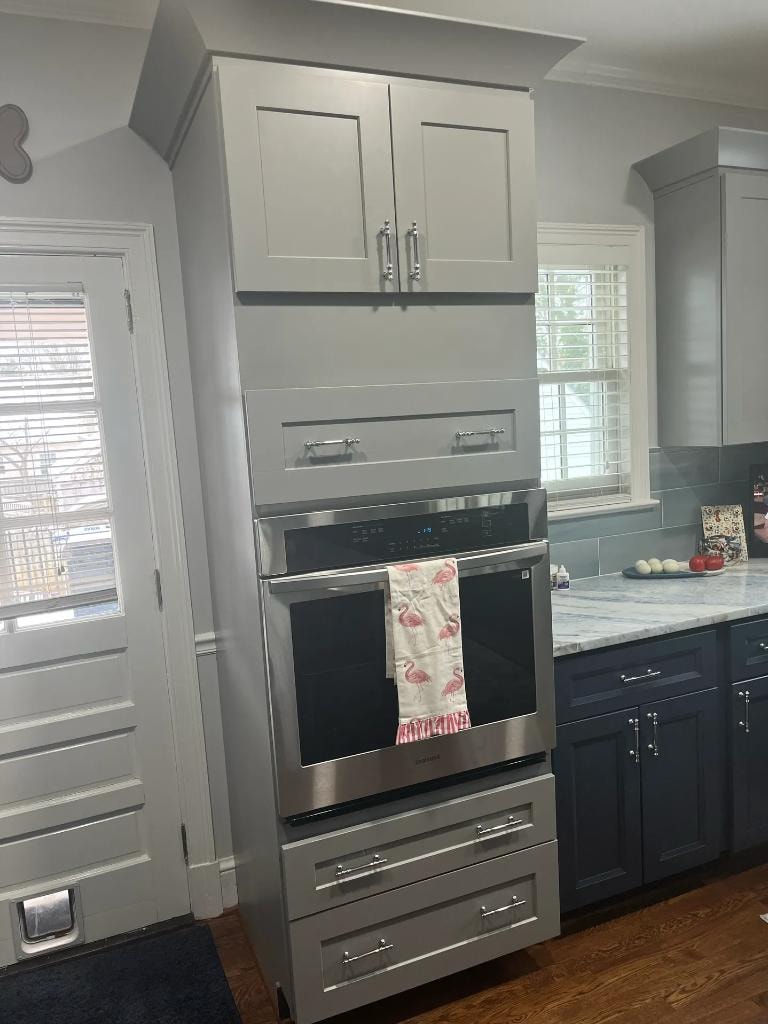 Kitchen remodel with double oven and gray cabinets by Cornerstone KB Pro